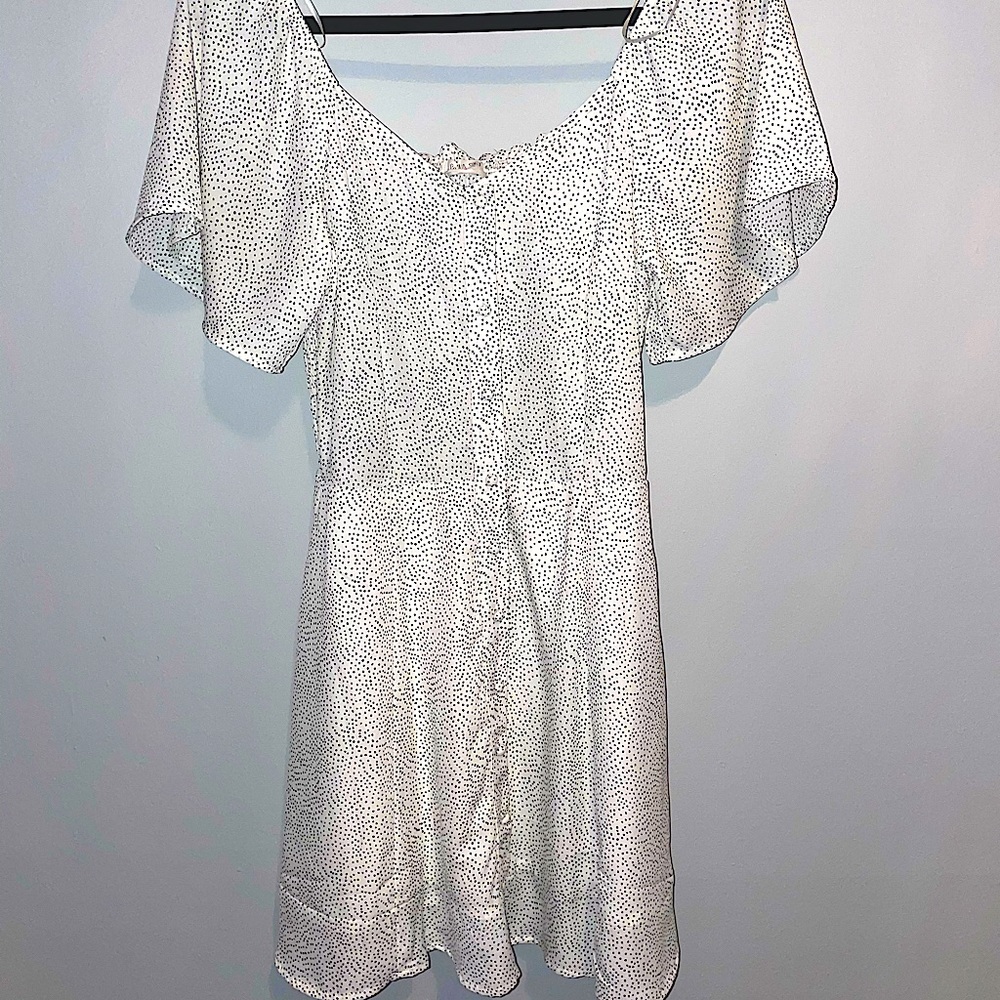 White mini dress with black polka dots